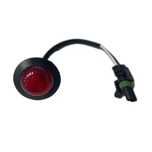 Round red LED marker light with black housing and wiring harness on white background