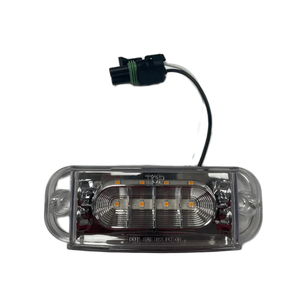LED truck cab marker light with clear lens and wiring connector on gray background