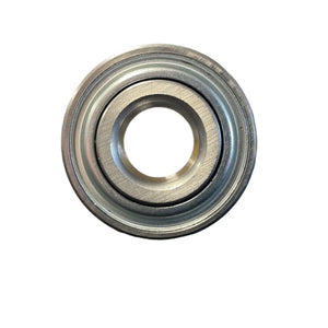 Close-up of a metal ball bearing on white background, circular industrial component